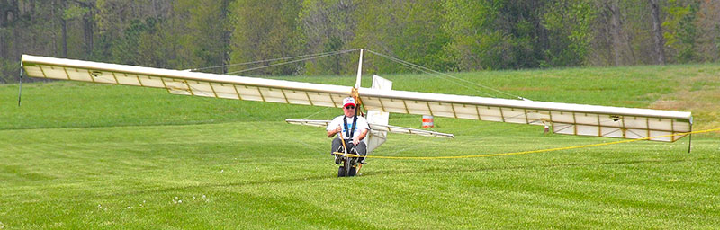Project manager Tom Tyndall of EAA Chapter 231 at the start of the ground roll for the Primary Glider flight test.