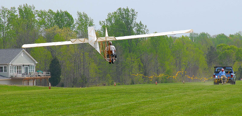 Glider test pilot releases the tow-line and continues the flight for about 1000 feet. A total of three flights were made the first day.